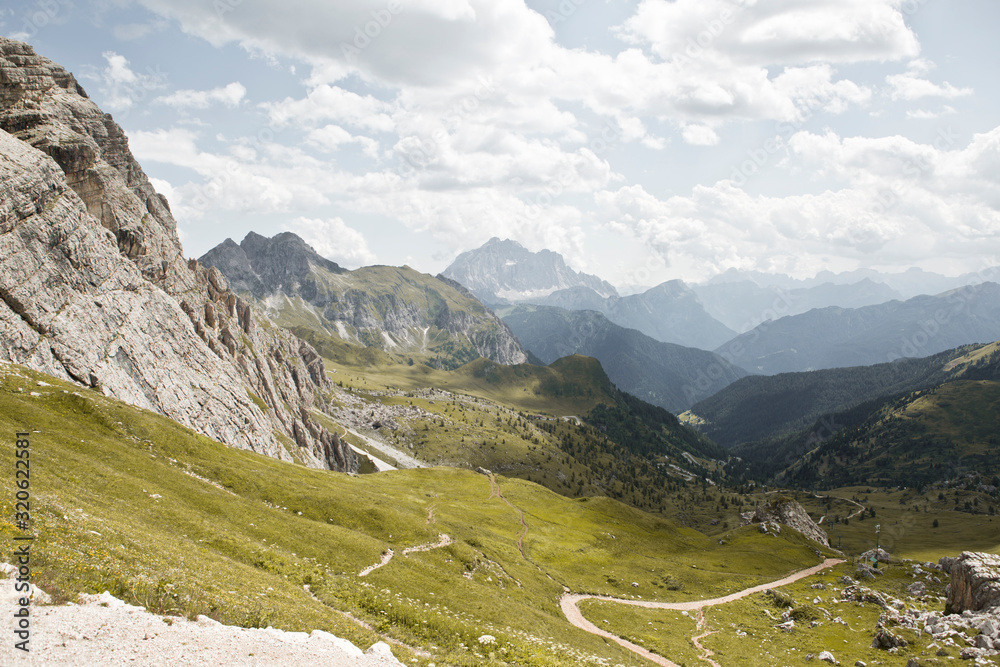 Hike the mountains of Passo Giau. The world famous Dolomites peaks in South Tyrol in the Alps of Italy. Belluno in Europe mountain scenery. Green hills