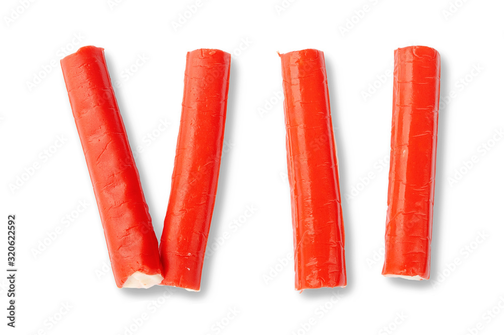 whole-crab-sticks-and-sliced-into-pieces-on-white-view-from-above-crab-sticks-with-shadow