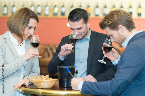 happy young couple tasting wine