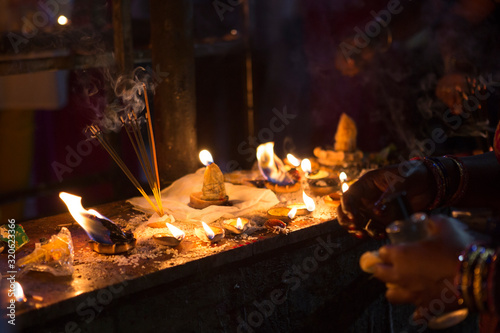 Candles close-up in the Indian Temple on a Religious Festival Diwali. Oil Lamp photo