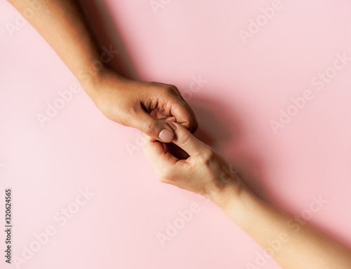 Woman holding hands.
