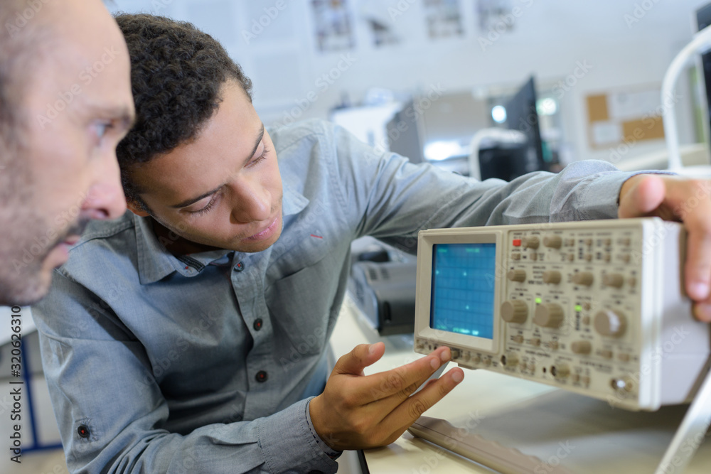 industrial technician checking a malfunctioned gadget industrial technician checking a malfunctioned gadget