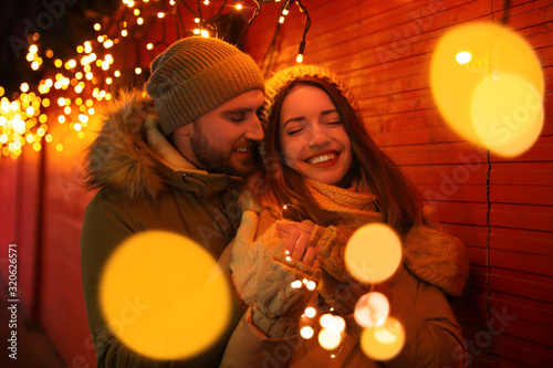 Happy couple spending time at Christmas fair