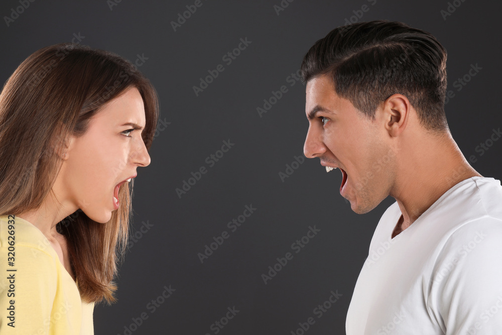 Couple quarreling on black background. Relationship problems Couple quarreling on black background. Relationship problems