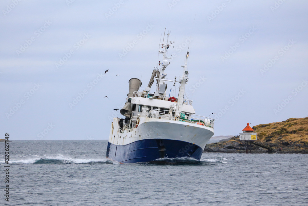 Fishing boat through Brønnøysundet, Nordland county Fishing boat through Brønnøysundet, Nordland county