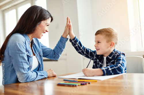 homework teaching boy high five education mother children son familiy childhood photo