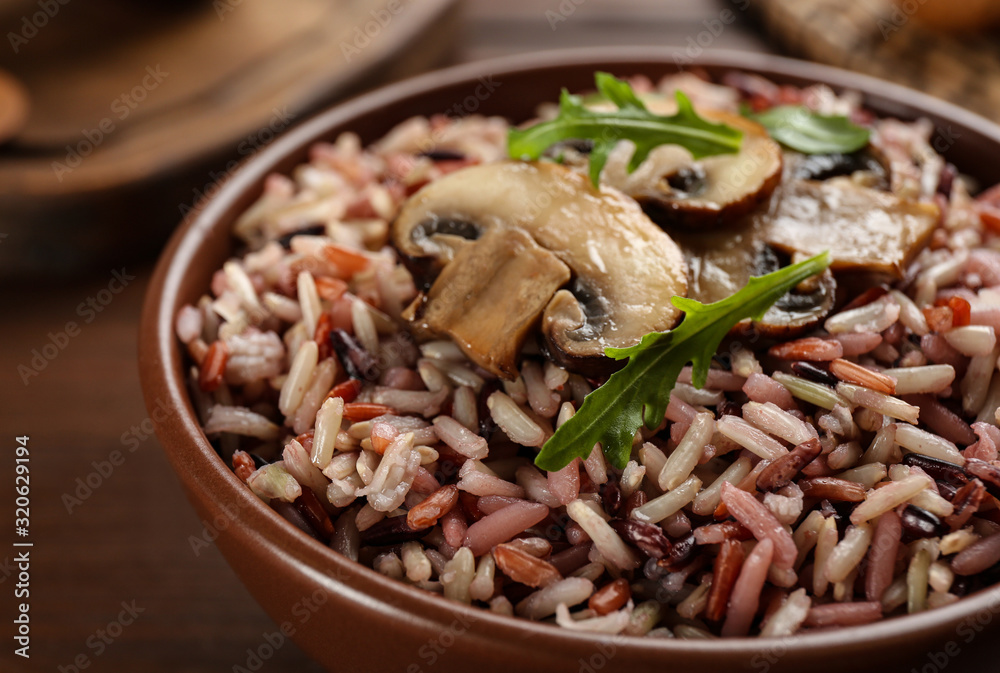 Delicious brown rice in bowl, closeup view Delicious brown rice in bowl, closeup view