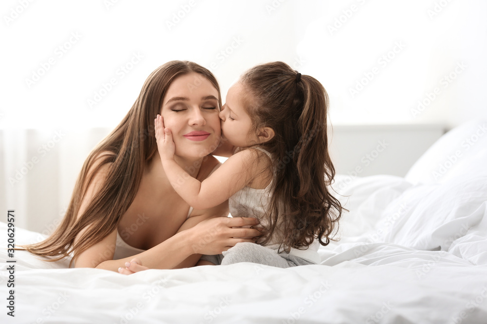 Happy mother with little daughter in bedroom Happy mother with little daughter in bedroom