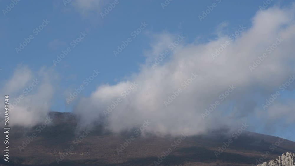 Mountain landscape time lapse moving clouds.