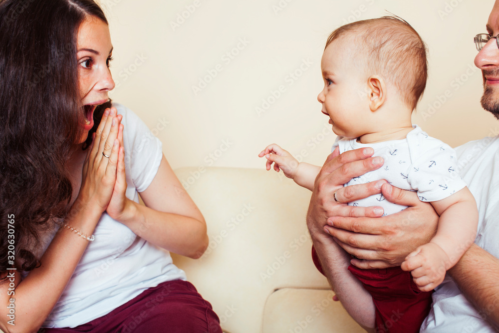 young happy modern family smiling together at home. lifestyle people concept, mother, father and little son young happy modern family smiling together at home. lifestyle people concept, mother, father and little son