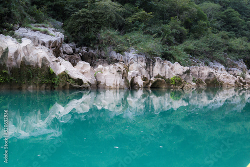 Amazing crystalline blue water of Tamul waterfall  Close up view of spectacular Tamul River at Huasteca Potosina in San Luis Potosi  Mexico