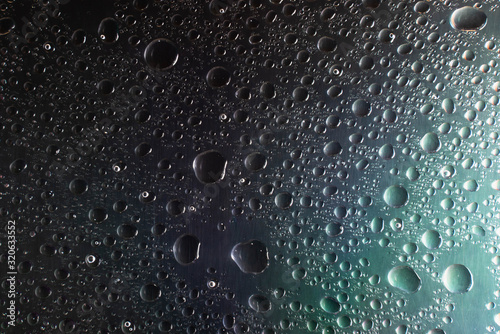 abstract water drop background on dark texture close up