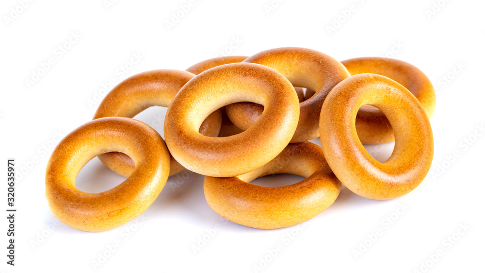 Small dry bagels, small rolls on a white background Small dry bagels, small rolls on a white background