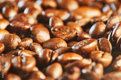 Grains of aromatic natural coffee macro shot. Close up.