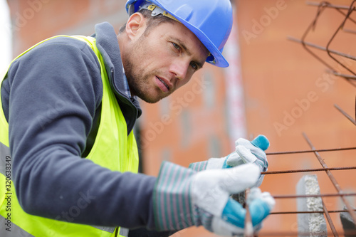 concentrated builder using bubble level at construction site