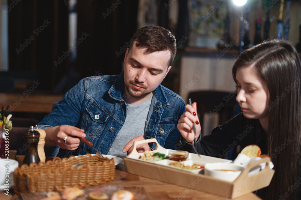Fototapeta premium Handsome couple having lunch