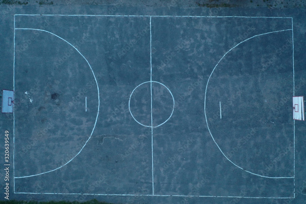 An unusual bird's-eye view of an unevenly painted basketball court An unusual bird's-eye view of an unevenly painted basketball court