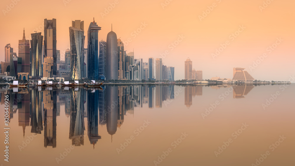 Skyline of West Bay and Doha City with reflection of buildings on water, Qatar