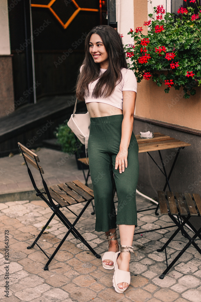 Beautiful model posing for the camera on the streets. Beautiful model posing for the camera on the streets.