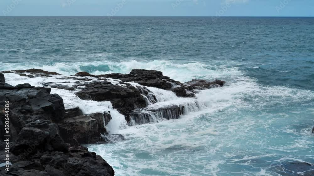 Slow motion, breaking waves and rocky coast, Tenerife island, Canary islands Slow motion, breaking waves and rocky coast, Tenerife island, Canary islands