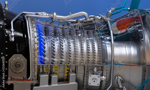 Plane engine element. Turbine blades. Blue light
