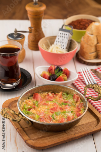 Turkish breakfast with menemen and tea