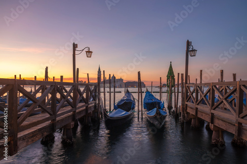 famous gondolas at sunrise. Venice, Italy. picture with long exposure © ver0nicka