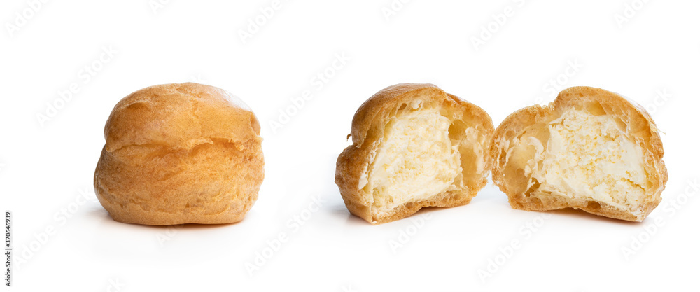 Homemade profiteroles stuffed with whipping cream isolated on white
