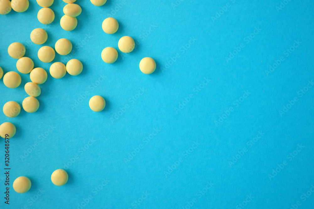 Pills on blue background. Top view with copy space. Medicine concept. Pills on blue background. Top view with copy space. Medicine concept.