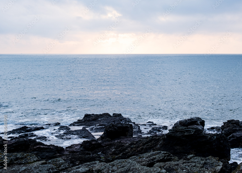 Picture of a seascape during sunset over the Atlantic Ocean, taken during winter. Picture of a seascape during sunset over the Atlantic Ocean, taken during winter.