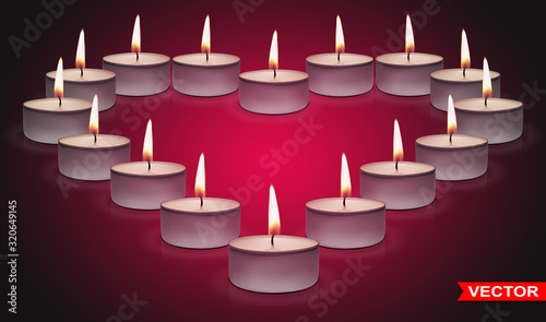 Realistic small round paraffin or wax aromatic decorative tealight heart shaped candles in metal box with fire flame. On pink background. Valentines day.