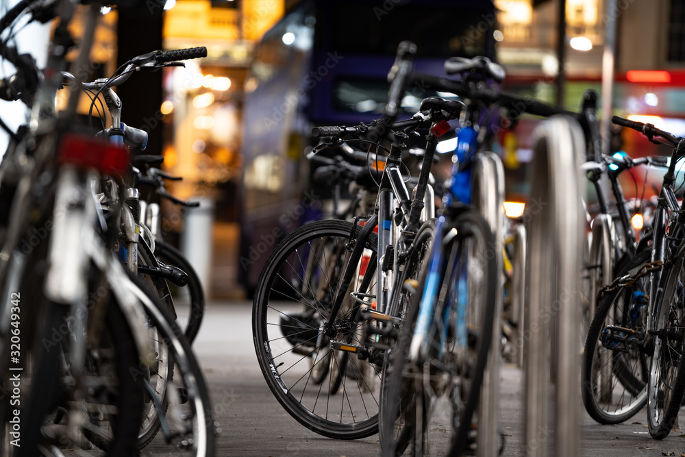 bicycles in rack at night