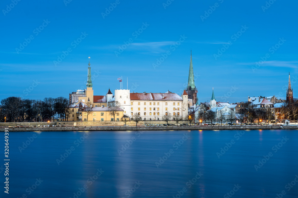 Riga's skyline and President Castle at night in winter, Old Town, Riga, Latvia Riga's skyline and President Castle at night in winter, Old Town, Riga, Latvia