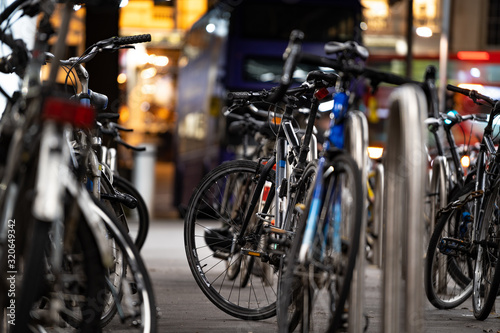 bicycles in rack at night © Georgios Karkavitsas