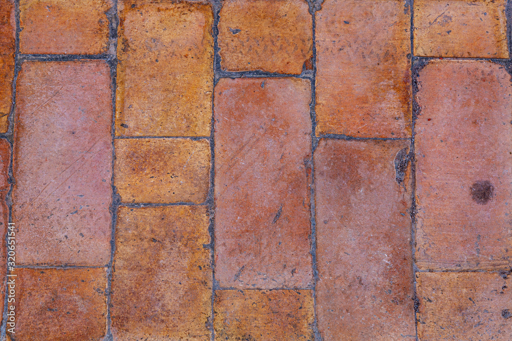 Newly laid red ground tile on a street Newly laid red ground tile on a street