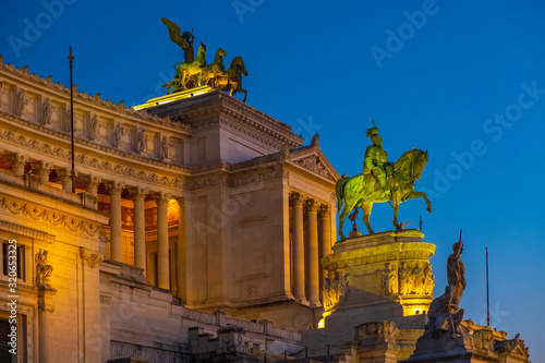 Rome, Italy - Evening view of the Victor Emmanuel II National Monument, known also as Altare della Patria - at the Piazza Venezia square and the Palatine Hill
