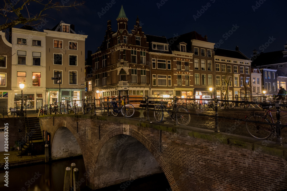 Bridge over the Utrecht Oudegracht canal at night 