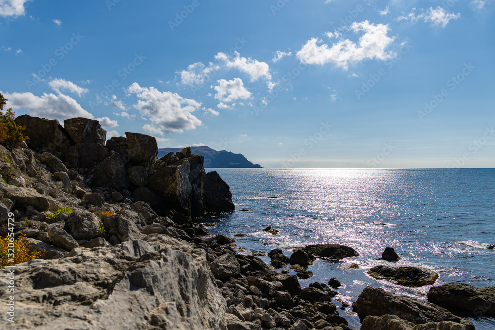 Scenic landscape with rocky coast of the Black Sea in surroundings of Sudak, Crimean peninsula. Cape Alchak in Sudak, Crimea Scenic landscape with rocky coast of the Black Sea in surroundings of Sudak, Crimean peninsula. Cape Alchak in Sudak, Crimea