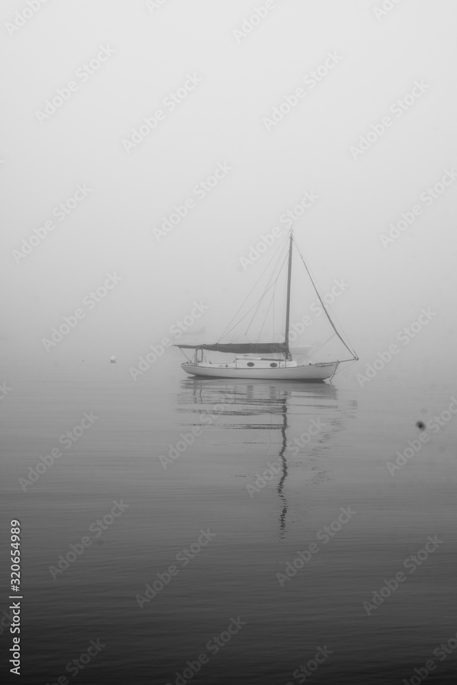 sailboat in fog