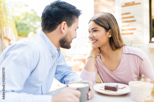 Hispanic Lovers Having Coffee During Date