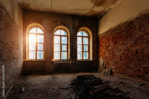 Old ruined abandoned mansion interior, vaulted windows