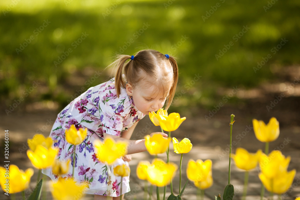 happy beautiful girl 4 years old with tails in the Park earlier spring happy beautiful girl 4 years old with tails in the Park earlier spring