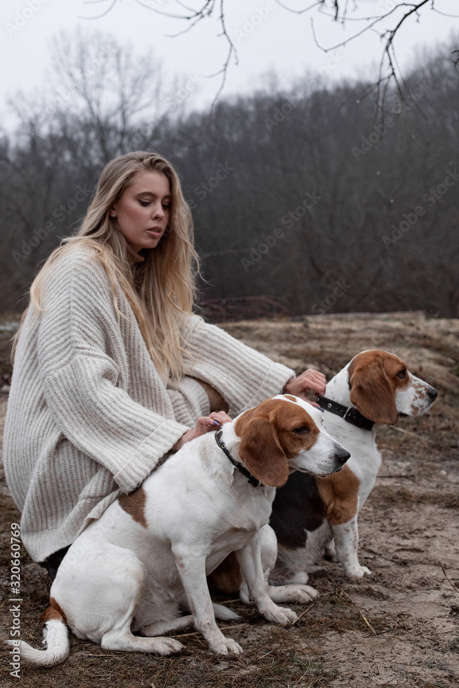Girl on a walk with dogs in the fall Girl on a walk with dogs in the fall