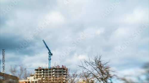 Lensbaby cool crane in motion on the background of moving clouds