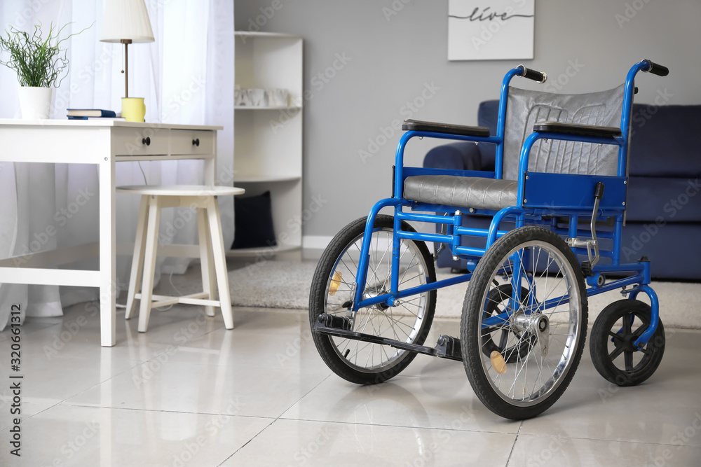 Modern empty wheelchair in room