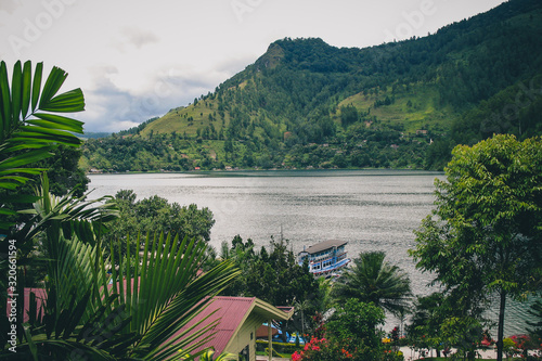 Lake Toba viewed from one of the restaurants in the city of Parapat, northern Sumatra on a cloudy day.