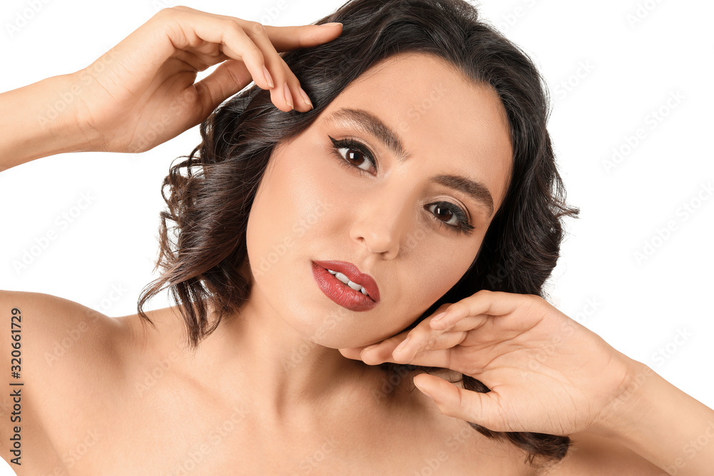 Fototapeta premium Beautiful young woman with stylish makeup on white background