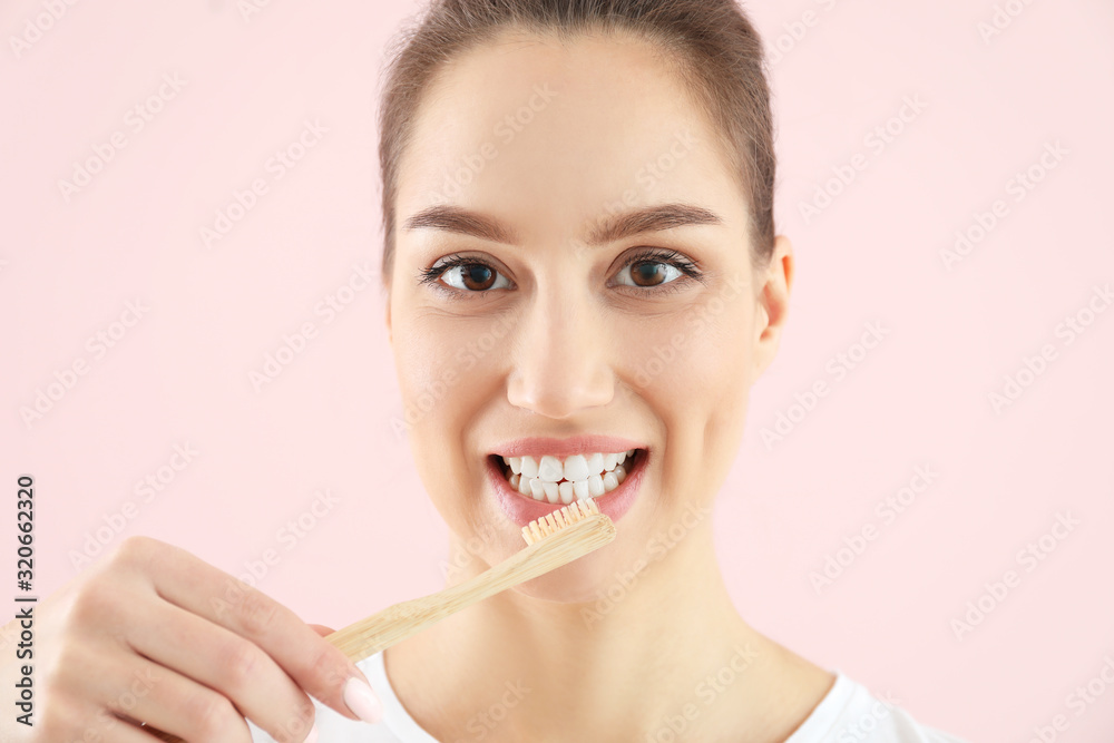 Beautiful young woman with tooth brush on color background Beautiful young woman with tooth brush on color background