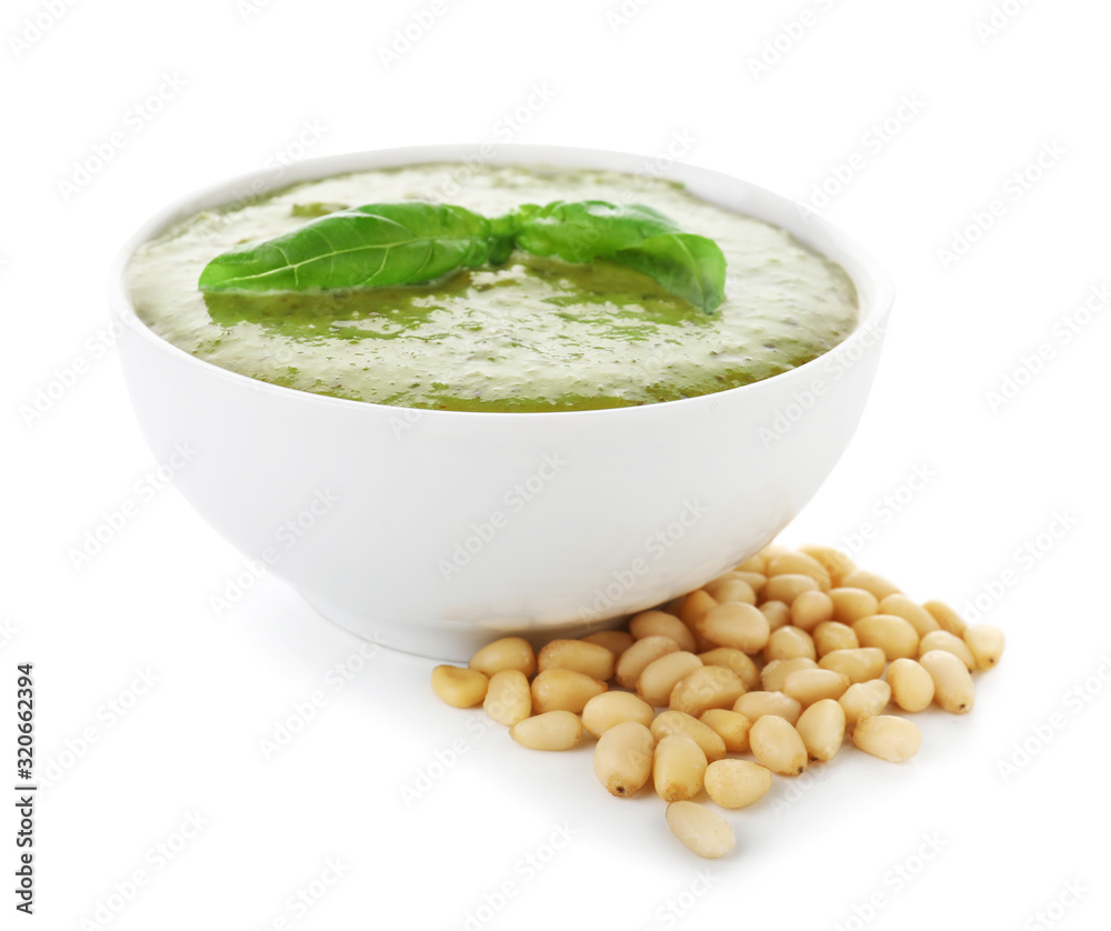 Bowl with tasty pesto sauce on white background Bowl with tasty pesto sauce on white background