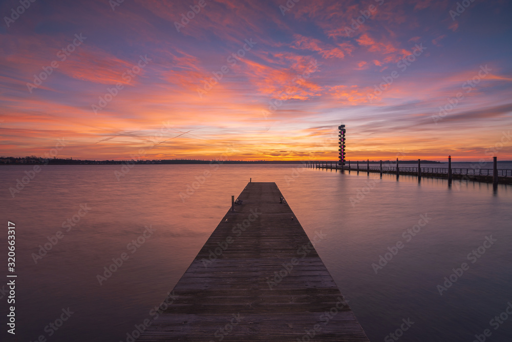 Soft and colorful sunrise at the pier